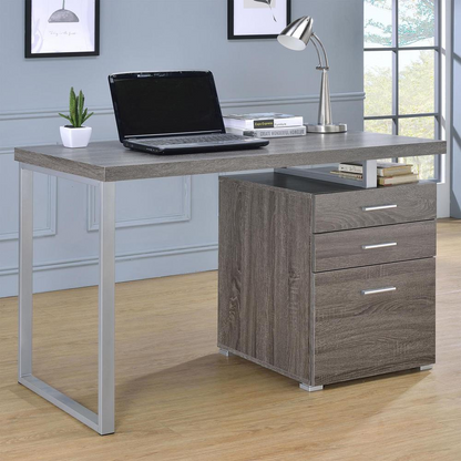 Weathered grey Brennan 47-inch office computer desk with three drawers by Start2Finish, featuring a sturdy wood finish and modern design.