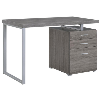 Weathered grey Brennan 47-inch office computer desk with three drawers by Start2Finish, featuring a sturdy wood finish and modern design.