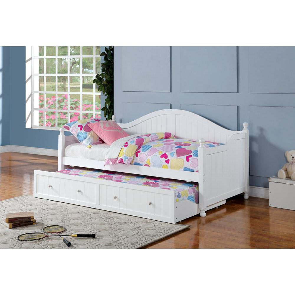 White Julie Ann Wood twin daybed with trundle from Start2Finish, featuring a classic design and wooden frame, displayed with bedding.