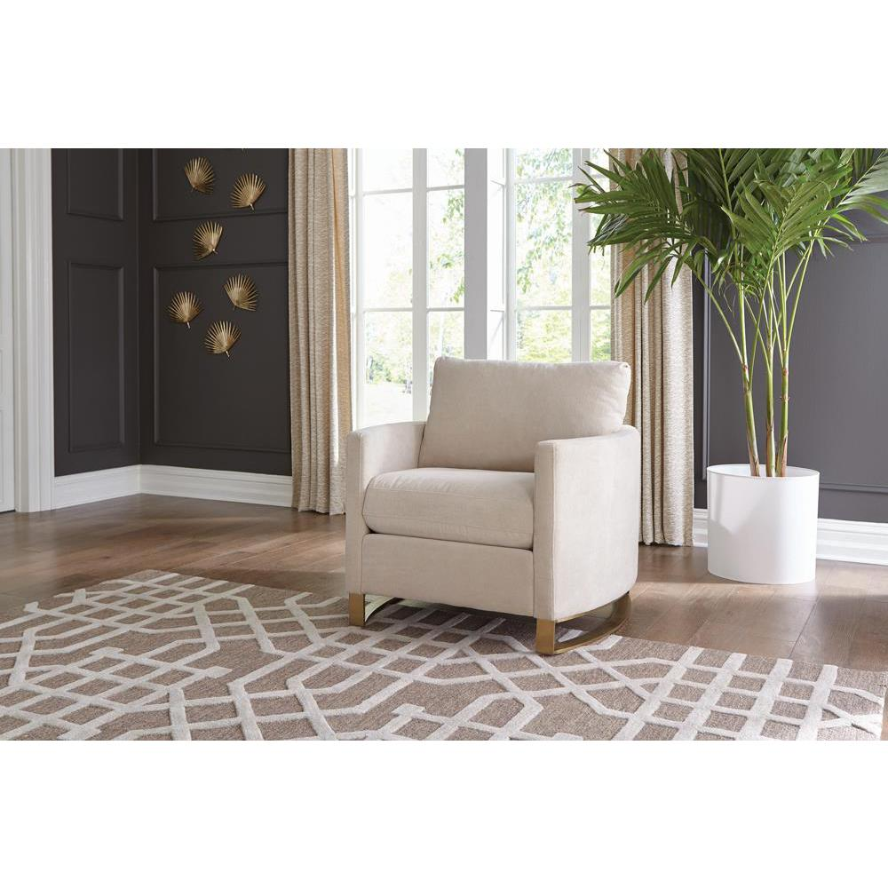 Corliss beige upholstered arched arm accent chair from Start2Finish, showing the stylish curved back and cushioned seating.