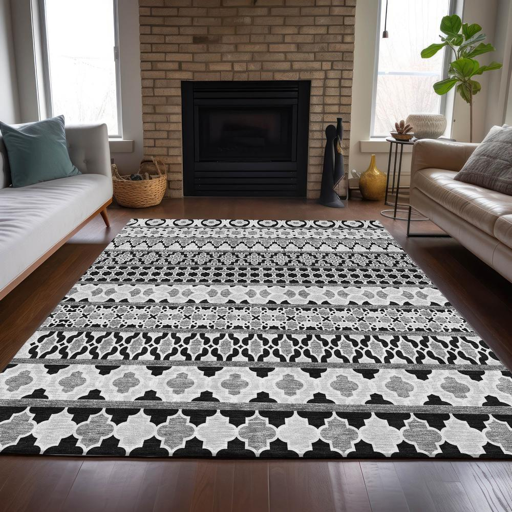 Start2Finish Chantille ACN726 black 10x14 rug featuring a textured woven pattern on a soft fabric surface.