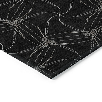 Start2Finish Chantille ACN968 black 10x14 rug with soft textured fabric and modern design, shown in a living room setting.
