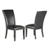 Pair of black PU side chairs from Start2Finish, modern design with sleek legs and comfortable seats.