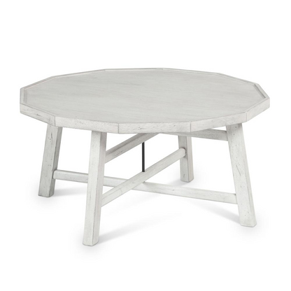 Paisley-patterned Start2Finish cocktail table with wooden legs and a circular top, showcasing a stylish and modern design.