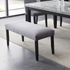 Napoli Gray Velvet Bench by Start2Finish featuring a plush velvet upholstered seating with wooden legs.