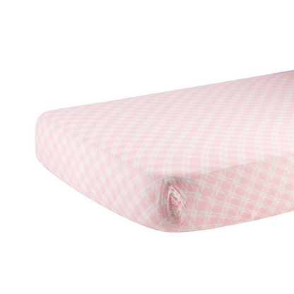 Soft pink plaid cotton muslin crib sheet for baby, by Start2Finish, with a cozy, breathable fabric design.