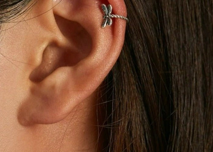 Sterling silver dragonfly ear cuff jewelry with detailed wing design, perfect for stylish and unique ear adornment.