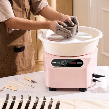 Pink VEVOR pottery wheel with LCD touch screen, foot pedal, shaping tools, 10-inch ceramic wheel, ideal for DIY art and craft projects.