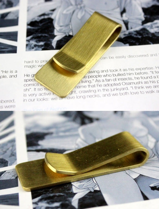 Fuchsia Molly brass money clip used as stylish home decor, featuring a sleek metallic design and polished finish.