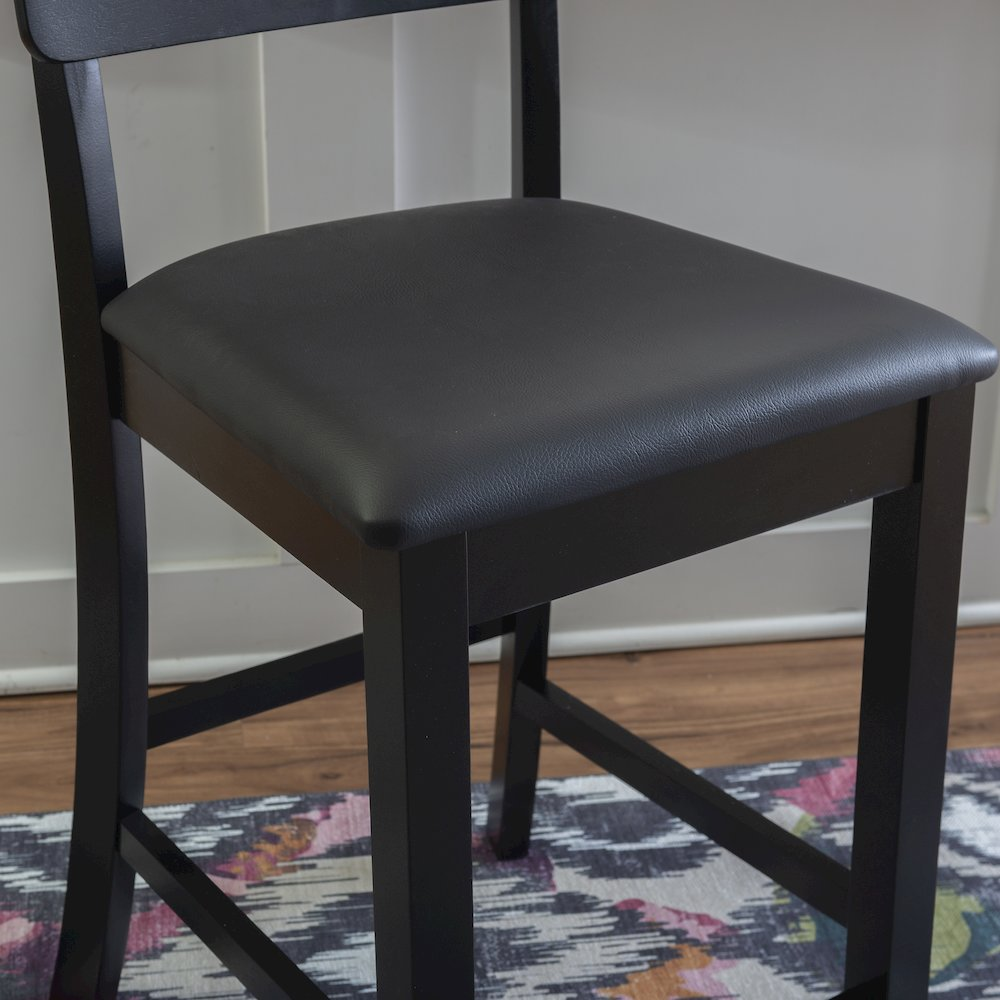 Contemporary Torino 24-inch counter stool by Start2Finish with wooden legs and cushioned seat, shown in a modern kitchen setting.