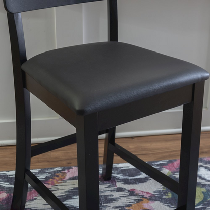 Contemporary Torino 24-inch counter stool by Start2Finish with wooden legs and cushioned seat, shown in a modern kitchen setting.