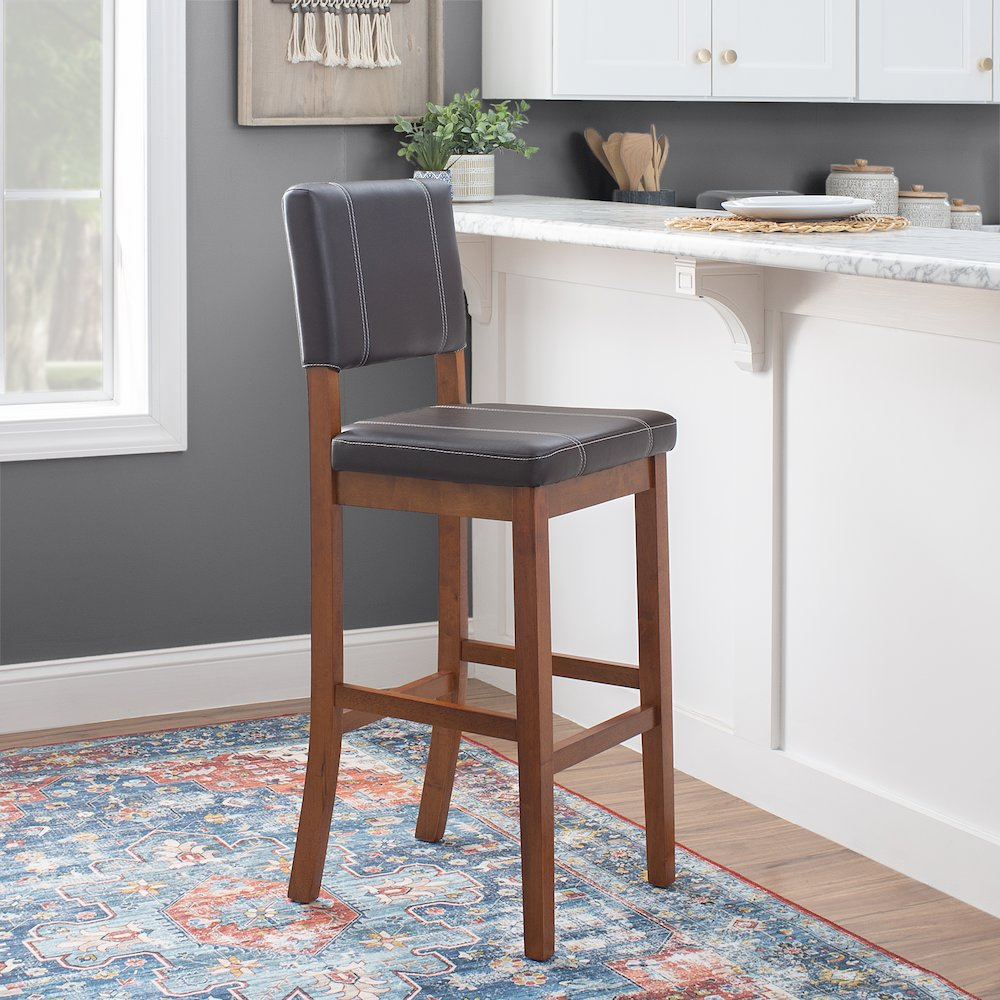 Milano brown bar stool by Start2Finish with a sleek seat and sturdy metal legs, ideal for modern kitchen or bar area.
