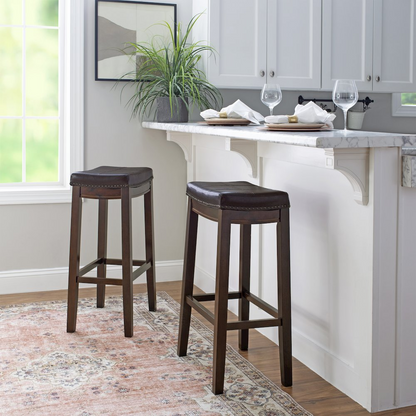 Start2Finish Claridge brown barstool with a padded seat and backrest, featuring sleek metal legs for modern style and comfort.
