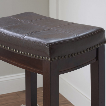 Start2Finish Claridge brown barstool with padded seat and wooden legs, shown from a side angle in a modern interior setting.