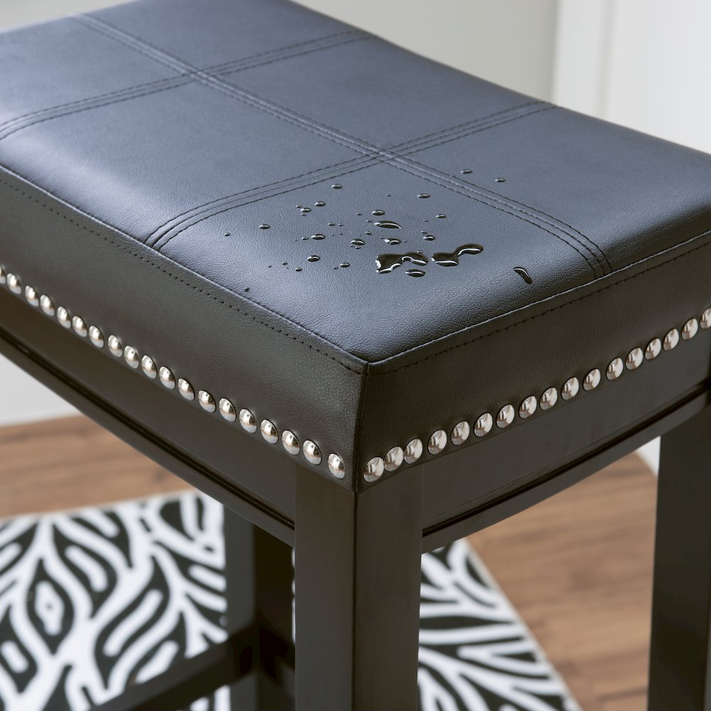 Black Claridge barstool by Start2Finish featuring a sleek design with a padded seat and metal legs for modern bar seating.