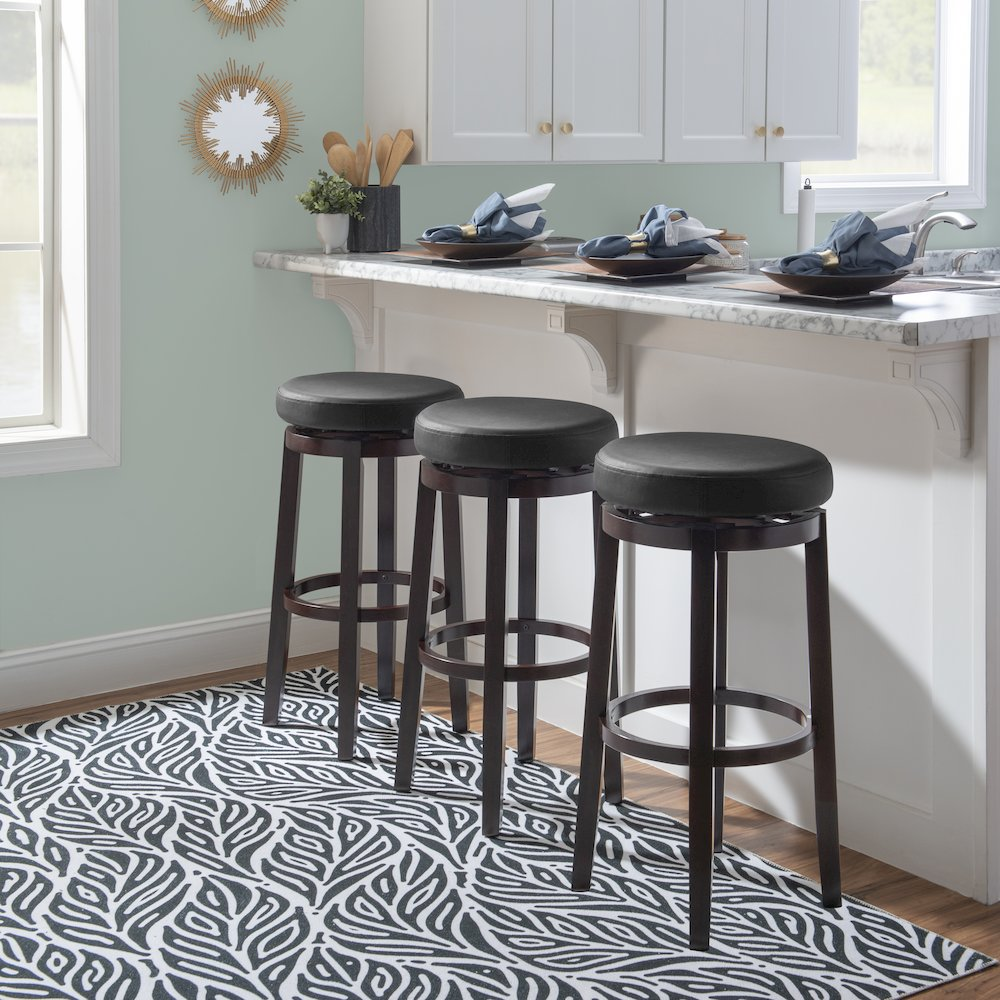 Maya Black 29-inch bar stool by Start2Finish with a modern design, featuring a sleek black seat and sturdy metal legs.