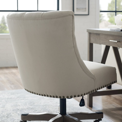 Della Natural Office Chair by Start2Finish featuring a cushioned seat, ergonomic design, and wooden armrests in a modern workspace setting.