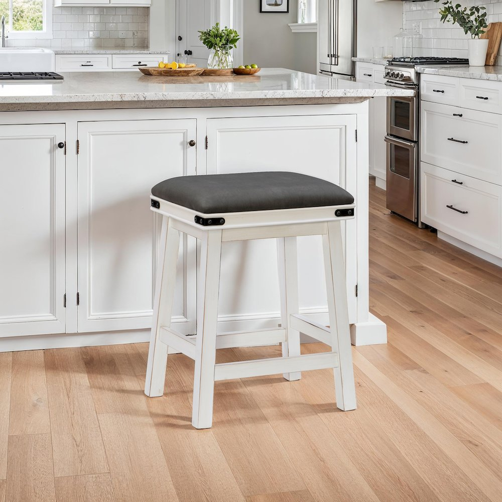 White Serrano counter stool by Start2Finish featuring a sleek, modern design with a cushioned seat and metal legs.