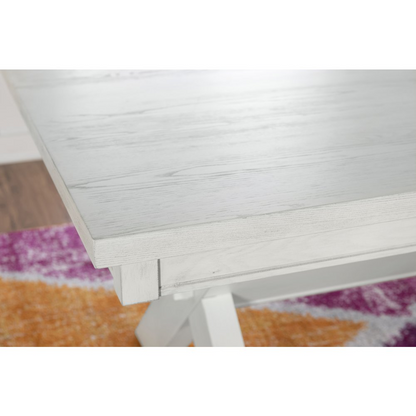 Distressed white Turino dining table by Start2Finish, showcasing a sturdy wooden furniture piece with a rustic finish and clean lines.