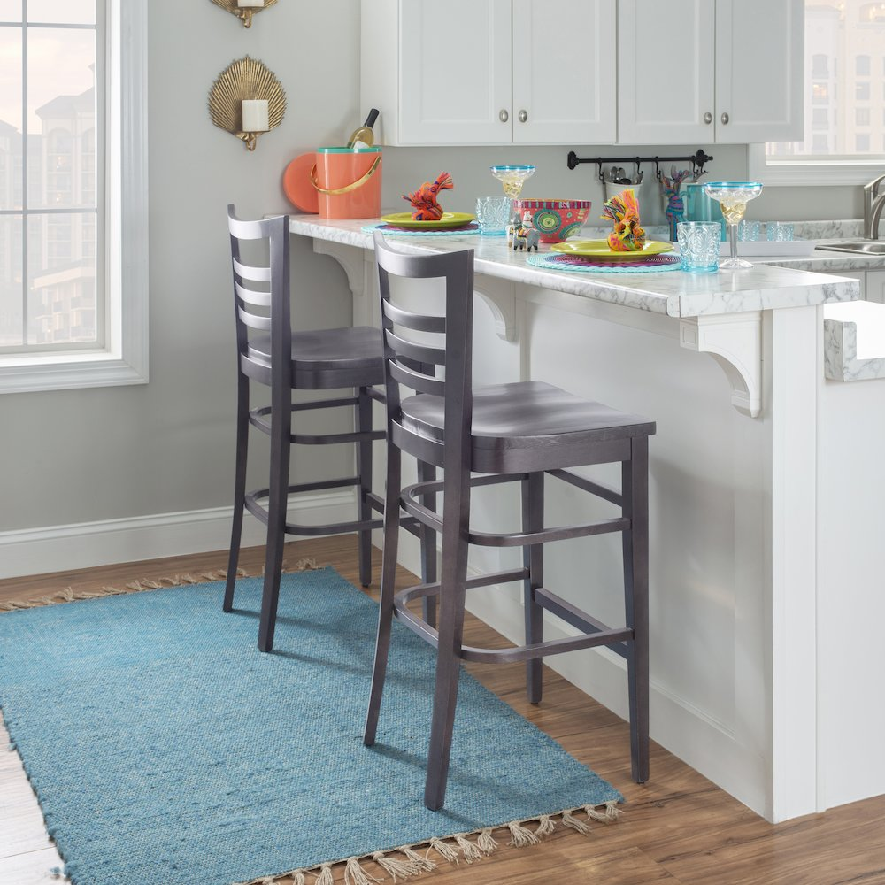 Set of two brown Blairmont barstools by Start2Finish, featuring cushioned seats and wooden legs for a modern kitchen or bar area.