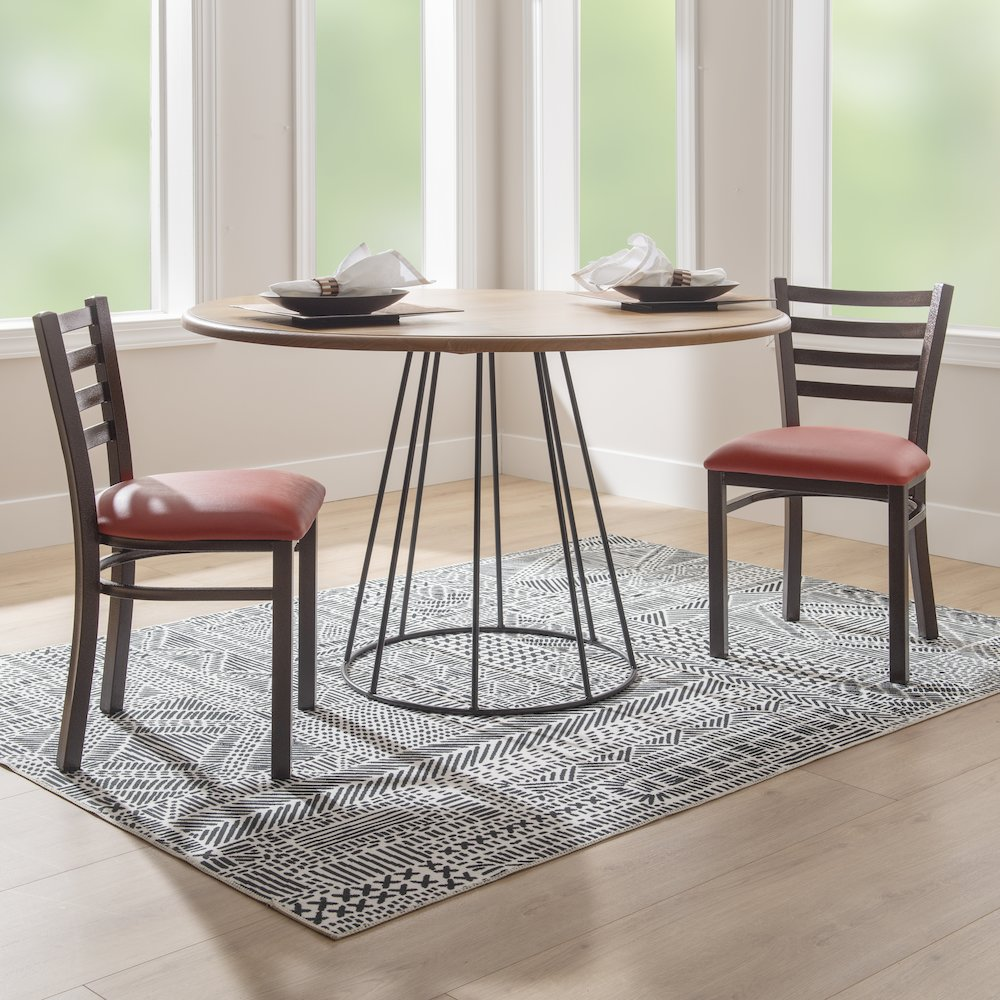 Pair of red Baxter metal side chairs by Start2Finish, featuring sleek metal frames and cushioned seats for dining or office use.