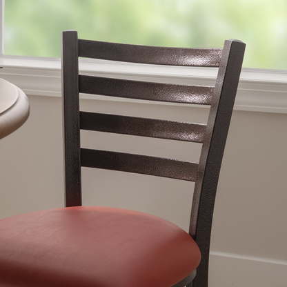 Set of two red Baxter metal side chairs by Start2Finish with sleek metal frames and modern design.
