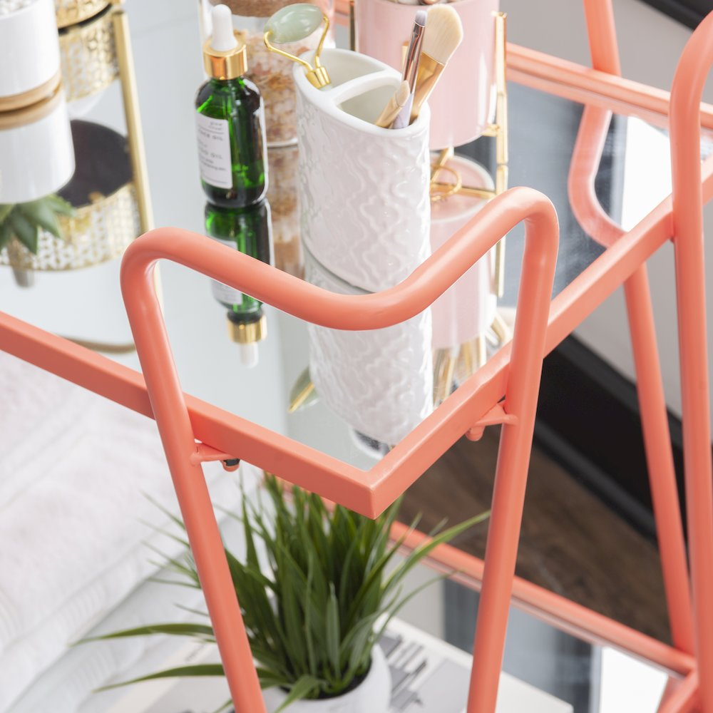 Coral mid-century bar cart by Start2Finish, featuring a sleek design with multiple shelves and a vibrant coral finish.