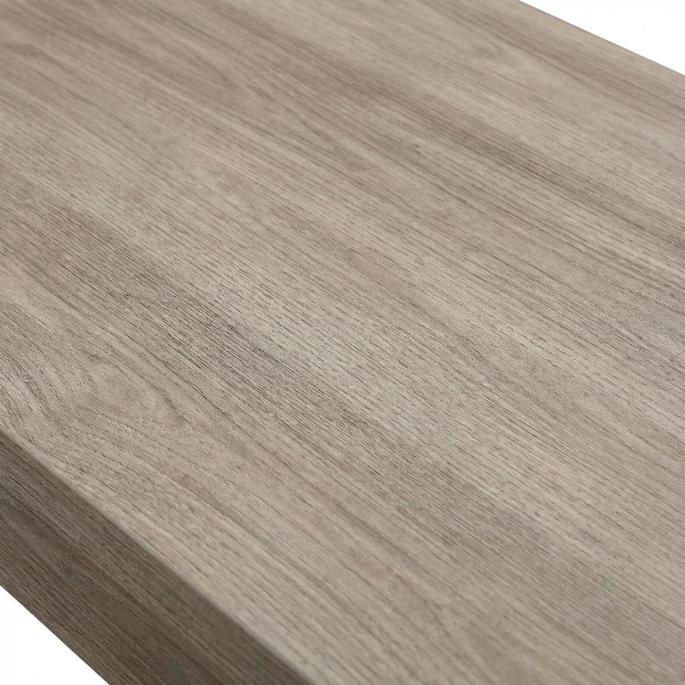Transit L Desk by Start2Finish in Salt Oak finish, showing the spacious L-shaped workspace and modern wood grain surface.