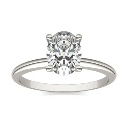 Oval lab-grown diamond solitaire engagement ring in 14K white gold with 1.5 carats total weight, featuring a classic design.