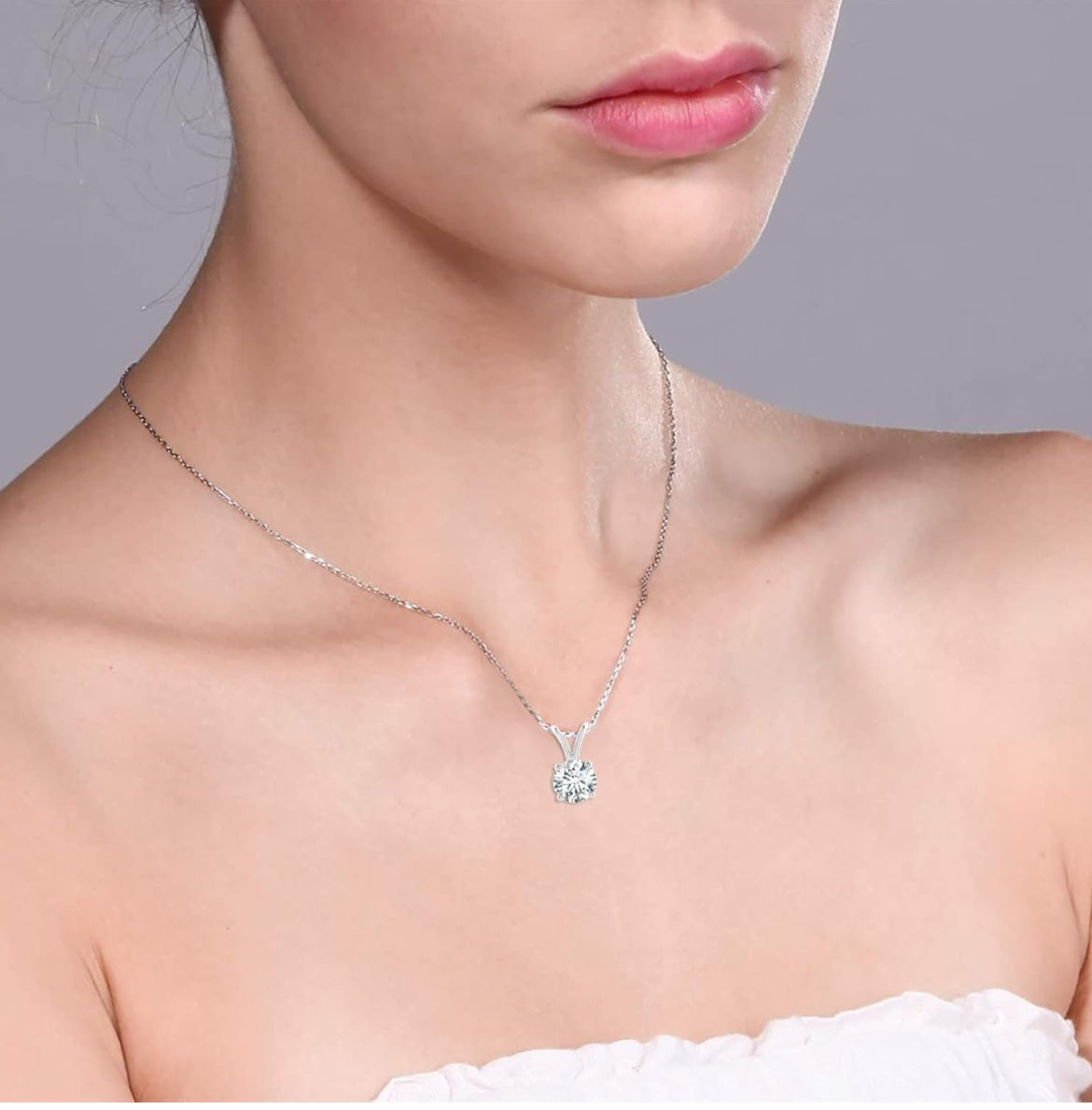 Round cut 1.00 CTW AGI certified lab grown diamond pendant in G/VS clarity, set in 14K white or yellow gold.