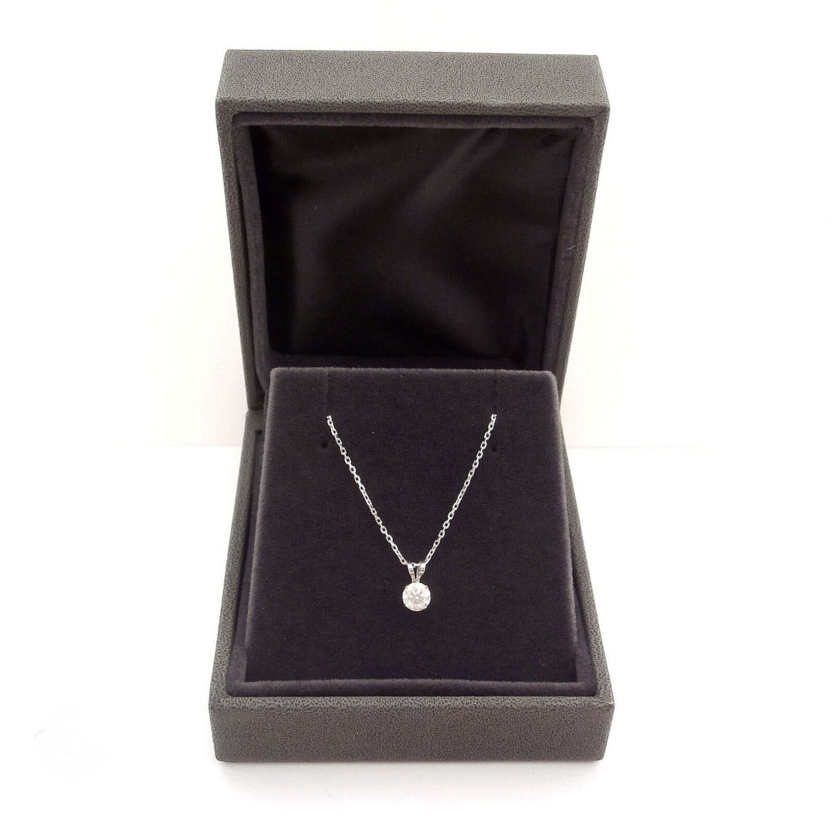 Lab grown diamond pendant with 1.00 CTW AGI certified round cut diamond in 14K white or yellow gold.