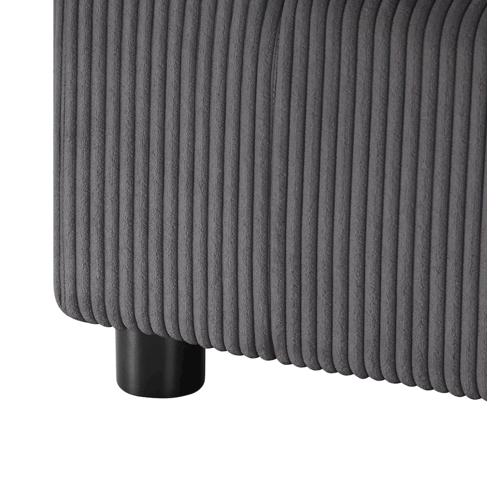 Modern Casella armchair by Start2Finish with charcoal corduroy upholstery, featuring a sleek design and comfortable armrests.