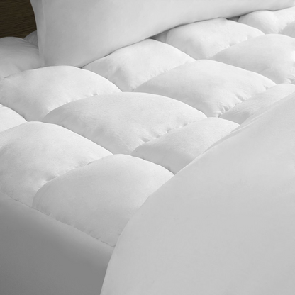 Start2Finish Dream Puff overfilled down alternative mattress pad in white, showing plush, quilted surface with soft padding.