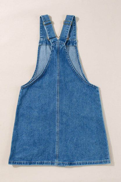 Dusk blue Carmine Juneberry denim mini dress with wide straps, button front, and front pockets, perfect for casual wear.