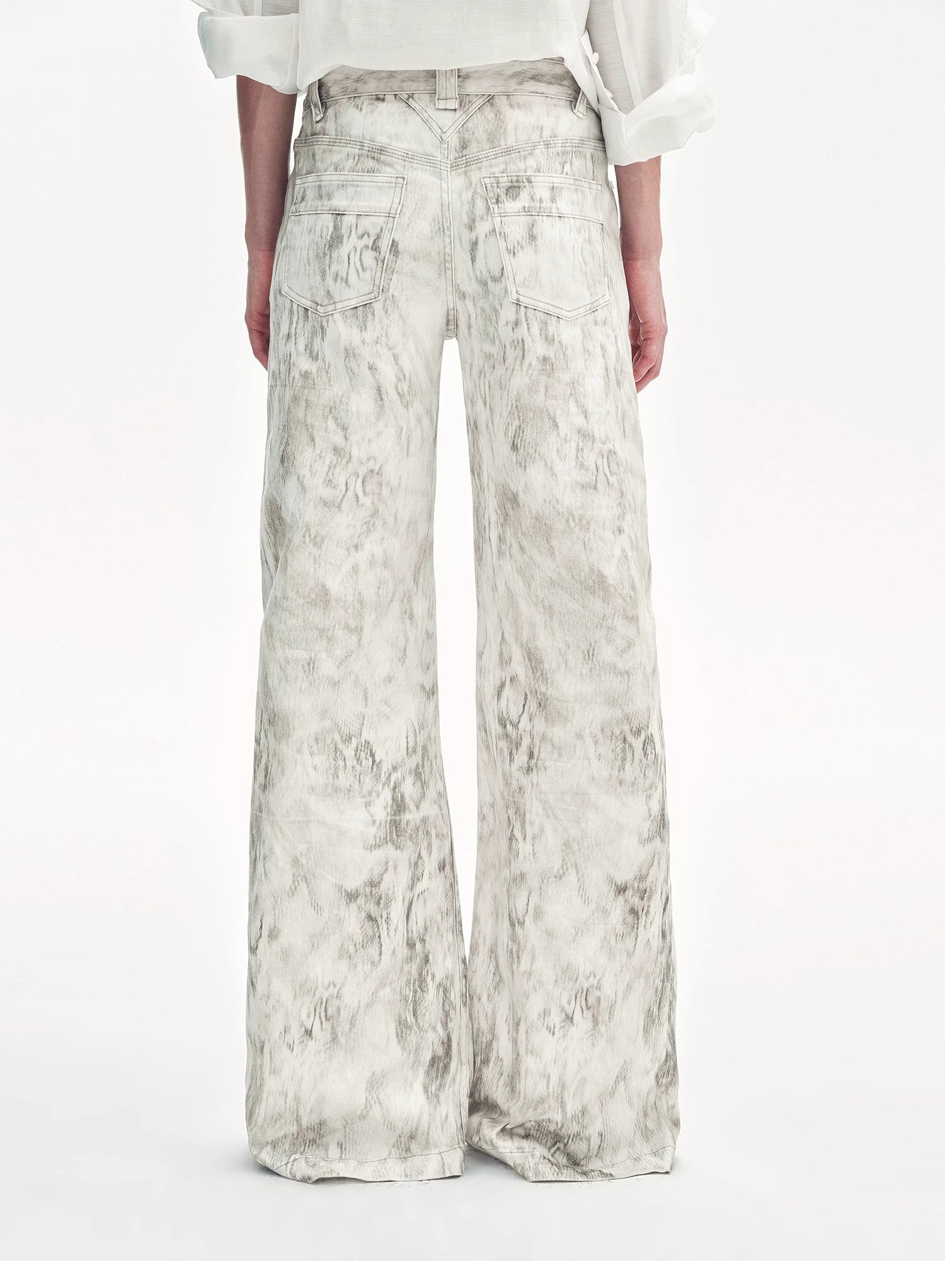 Brown Coeus Phantom snake print flared denim trousers, shown as stylish jackets and coats with a bold snake print pattern.