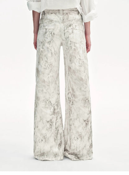 Brown Coeus Phantom snake print flared denim trousers, shown as stylish jackets and coats with a bold snake print pattern.