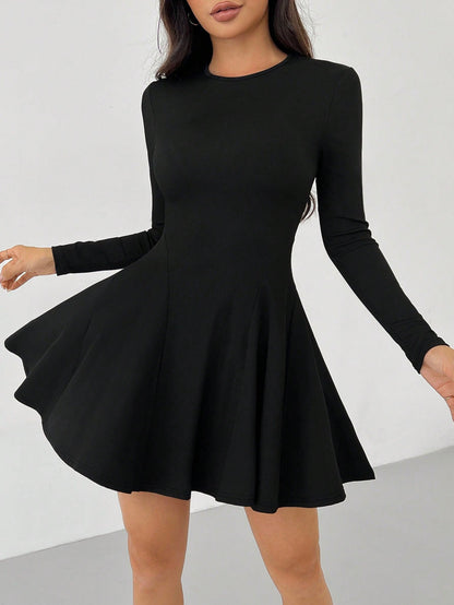 Green Alcestis dress with a flowing design, featuring a fitted bodice and wide skirt, perfect for elegant occasions.