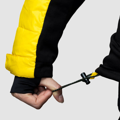 Women’s yellow EcoDown jacket by Rose Hemera, lightweight and insulated activewear with a sleek, stylish design.