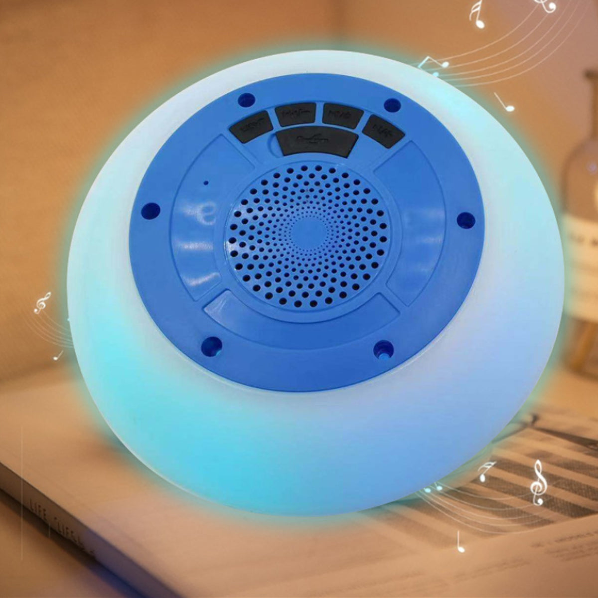 Salmon Lucky Floatilla waterproof Bluetooth speaker with LED lights floating in a pool, designed for swimming and outdoor use.