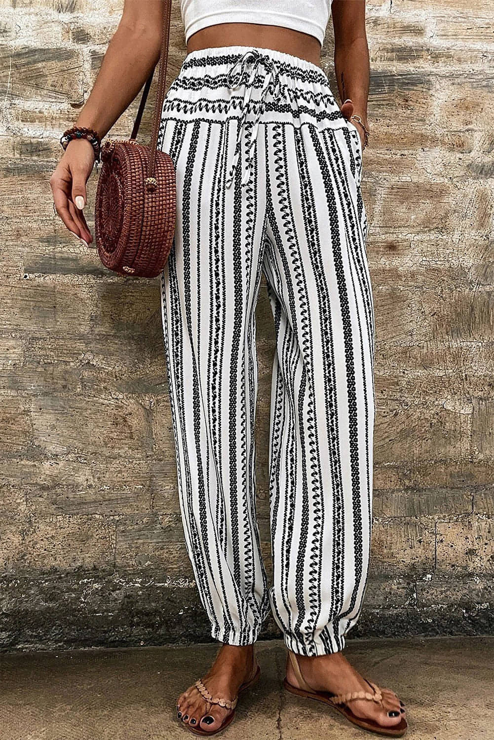 Black stripe boho casual pants by Carmine Juneberry featuring a striped print and relaxed fit.