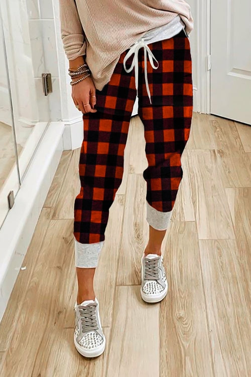 Women’s plaid drawstring joggers by Jade featuring a relaxed fit and casual style, perfect for cozy, everyday wear.