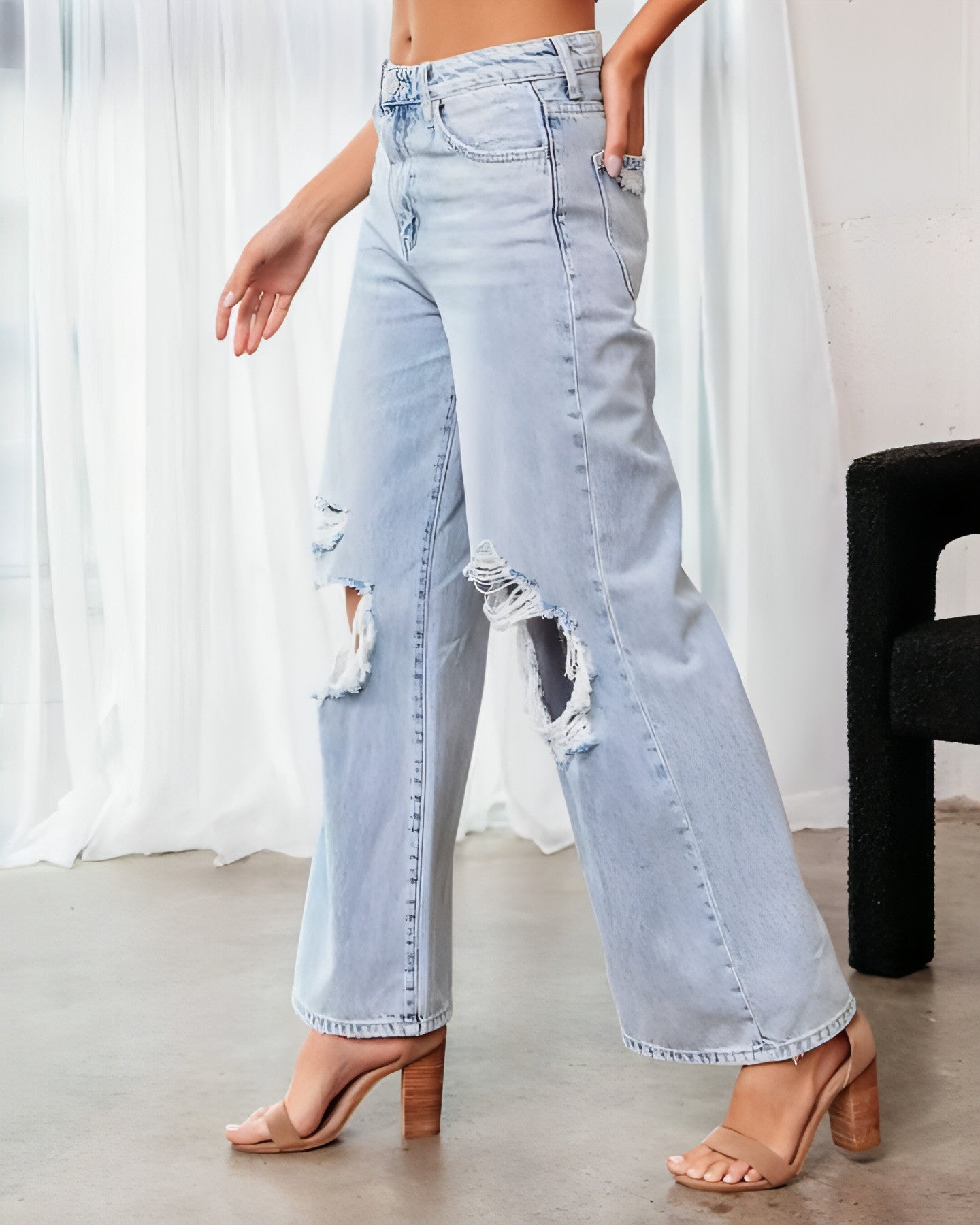 Carmine Juneberry ripped slimming jeans for women, featuring distressed details and a fitted silhouette, shown on a model.