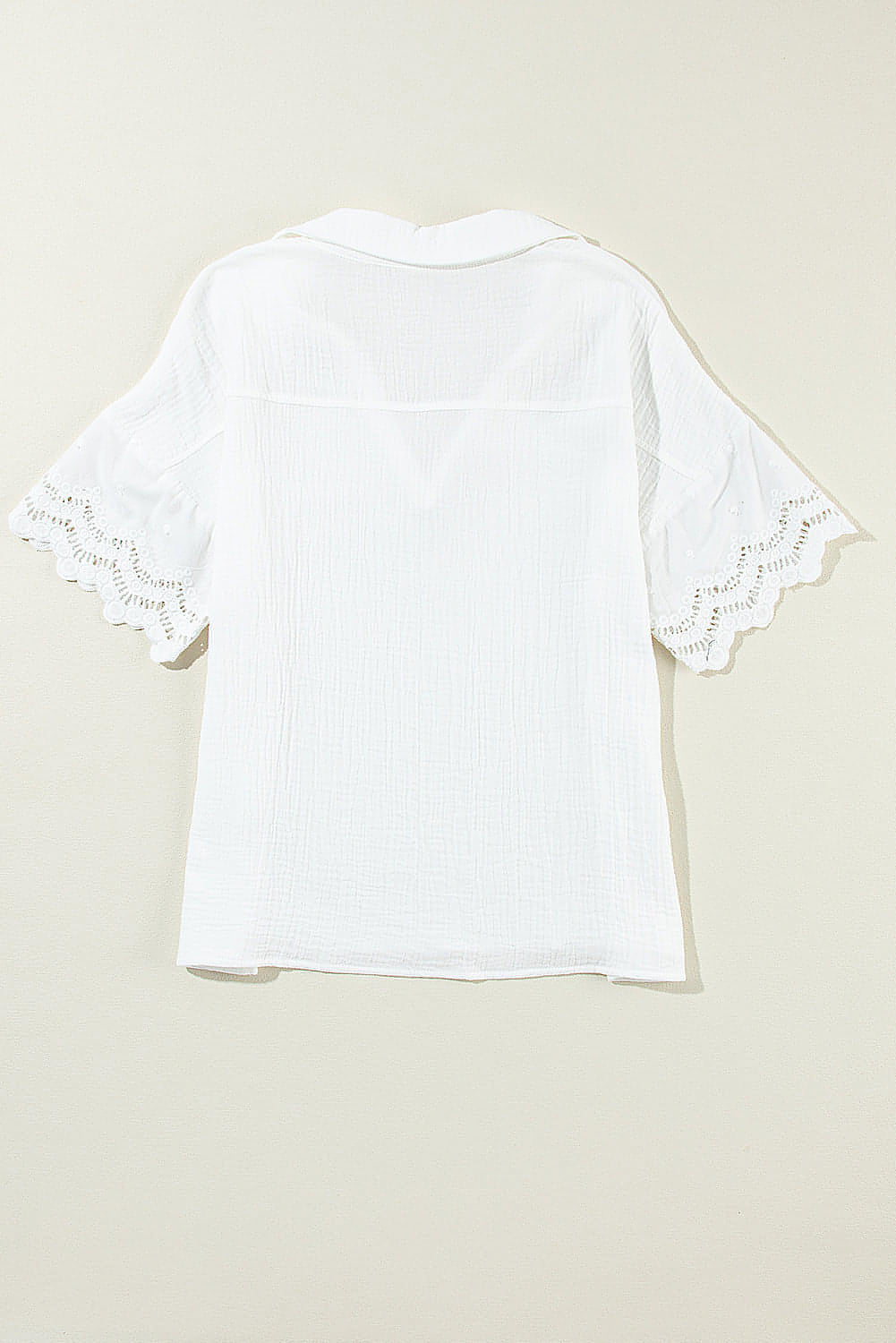 White crinkled lace splicing sleeve collared V-neck blouse from Carmine Juneberry, showcasing intricate lace details and stylish design.