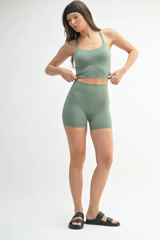 Jade Icarus Mono B Venice Cloud Light Crisscross Sports Bra for women, featuring a stylish cloud print and crisscross back design.
