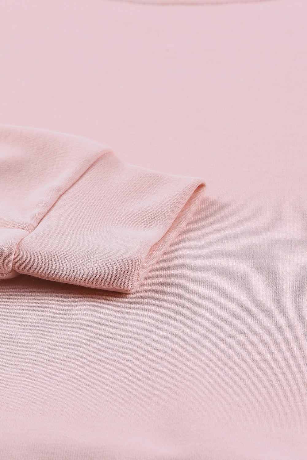 Pink crew neck sweatshirt with slit buttons from Harlequin Daisy, casual bath and beauty apparel, shown with soft fabric details.