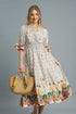 Umgee printed smocked waist flounce sleeve midi dress, light fabric with floral print, displayed on a hanger.