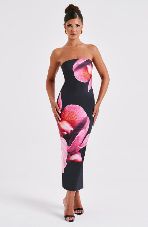 Carmine Juneberry 25 Edition backless floral draped tube maxi dress, elegant floral pattern, flowing fabric, and fitted silhouette.