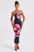 Carmine Juneberry 25 Edition backless floral draped tube maxi dress, elegant floral pattern, flowing fabric, and fitted silhouette.