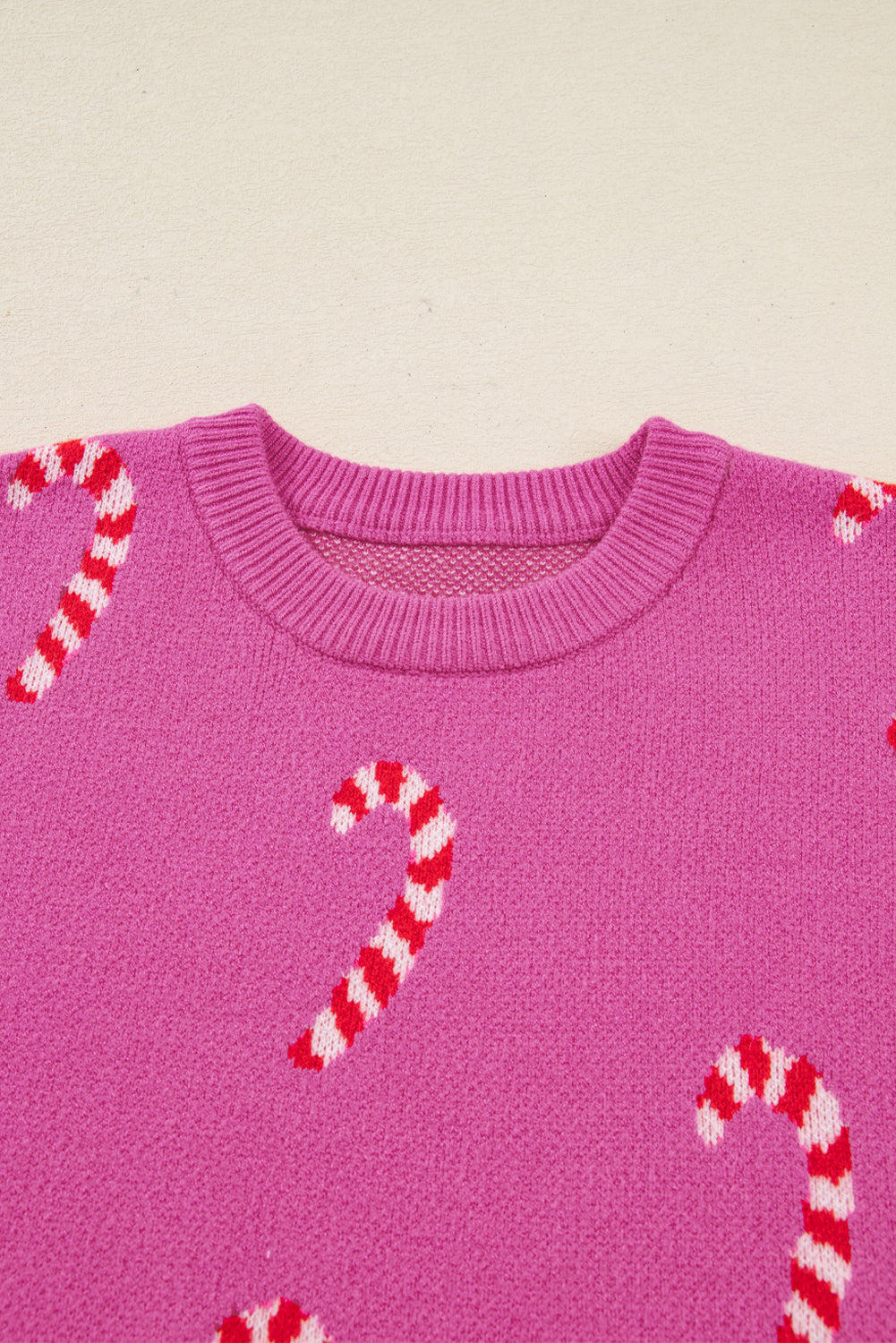 Byzantium Bay Christmas candy cane drop shoulder sweater with festive red and white striped design on soft knit fabric.