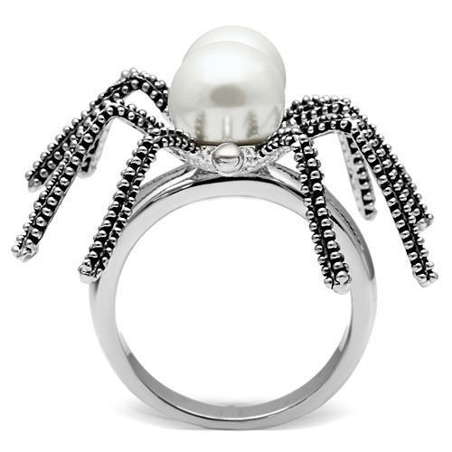 Rhodium brass ring with white synthetic pearl by Turquoise Tiger, showcasing a sleek design and polished finish.